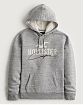 Moscow USA предлагает Вам купить винтажную мужскую толстовку с капюшоном Hollister серого цвета с белой нашитой надписью. Модель 06549. Доставка по России, Москве и области, самовывоз.