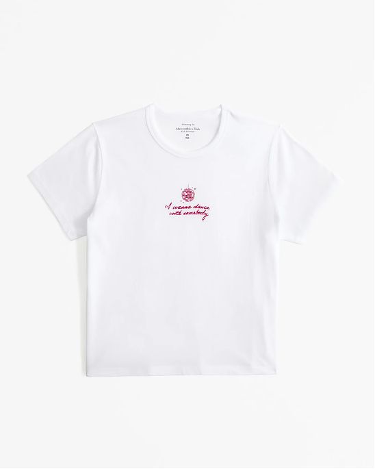 Женская футболка белого цвета Abercrombie & Fitch Whitney Houston белого цвета нашитой графикой. Модель 07859. Подробное описание и цена товара. Бесплатная доставка по России, Москве и Области от Moscow USA