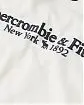 Женская футболка белого цвета Abercrombie Fitch с темно-синей надписью. Модель 05972. Подробное описание и цена товара. Доставка по России, Москве и Области от Moscow USA
