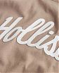 Женская футболка Hollister коричневого цвета с фирменным логотипом. Модель 06530. Подробное описание и цена товара. Доставка по России, Москве и Области от Moscow USA