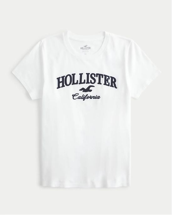 Женская футболка Hollister белого цвета с нашитым логотипом. Модель 07032. Подробное описание и цена товара. Доставка по России, Москве и Области от Moscow USA