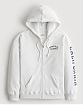 Женская толстовка с капюшоном Hollister Oversized белого цвета с нашитой. Модель 06911. Подробное описание и цена товара. Доставка по России, Москве и Области от Moscow USA